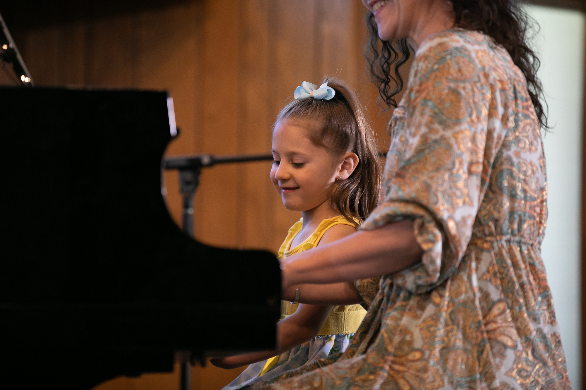 Young piano student learning during a private lesson